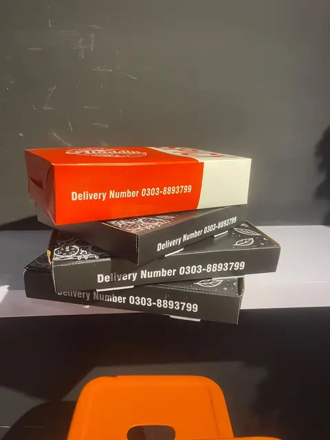 Red and black boxes printed with the delivery number.
