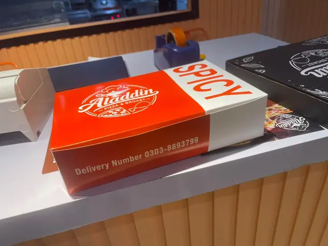 A red spicy box on the shop counter.